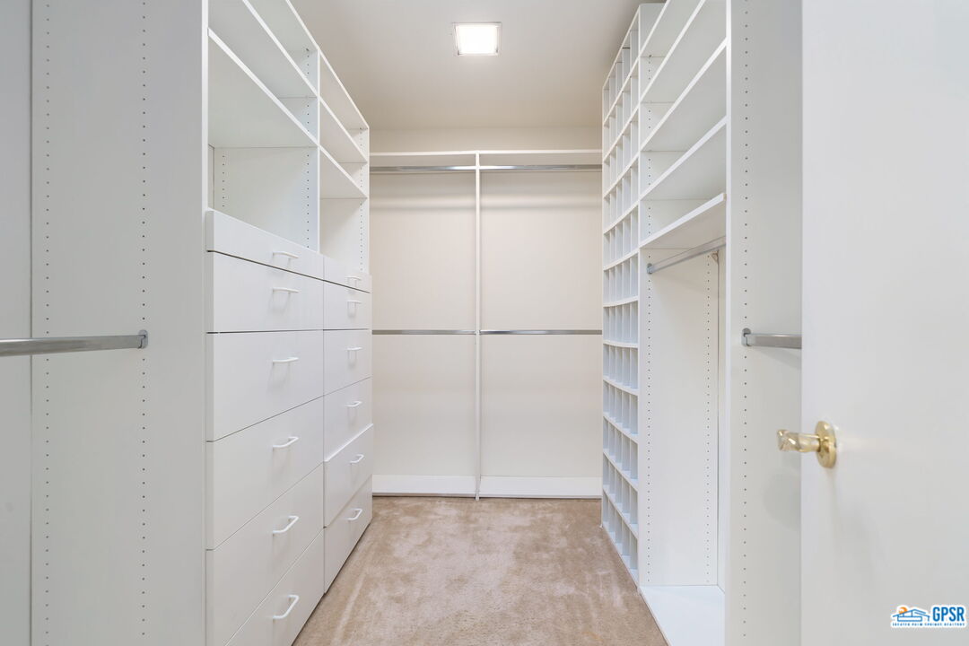 75 Colgate Drive Rancho Mirage, CA 92270 - Photo 40 of 52 a view of an empty walk in closet