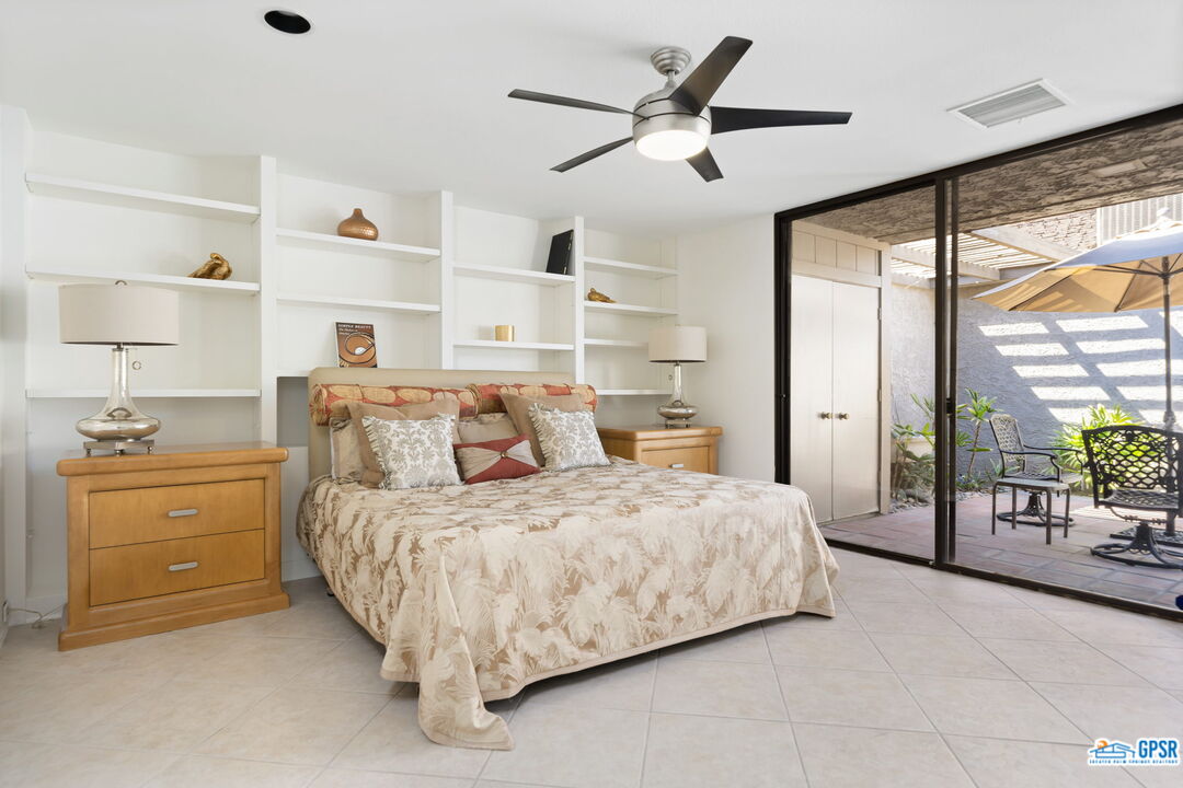 75 Colgate Drive Rancho Mirage, CA 92270 - Photo 41 of 52 a bedroom with a large bed and a large window