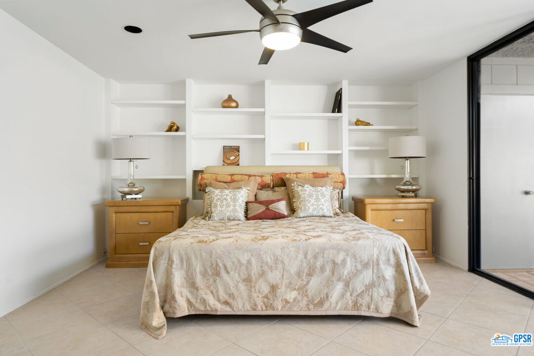 75 Colgate Drive Rancho Mirage, CA 92270 - Photo 42 of 52 a bedroom with a bed and cabinets