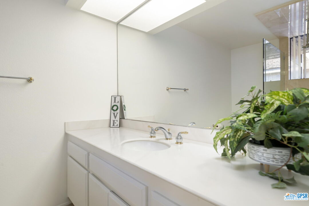 75 Colgate Drive Rancho Mirage, CA 92270 - Photo 43 of 52 a bathroom with a sink and a mirror