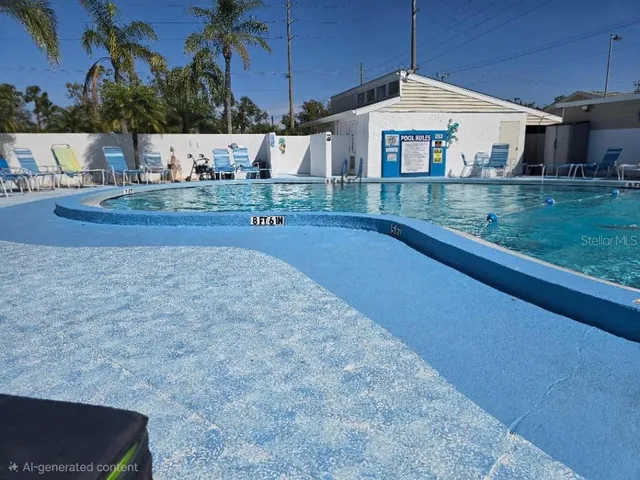 a view of a patio with table and chairs