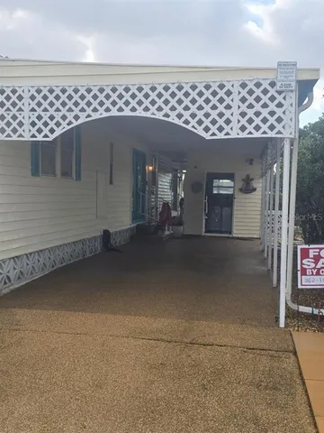 a view of house with backyard