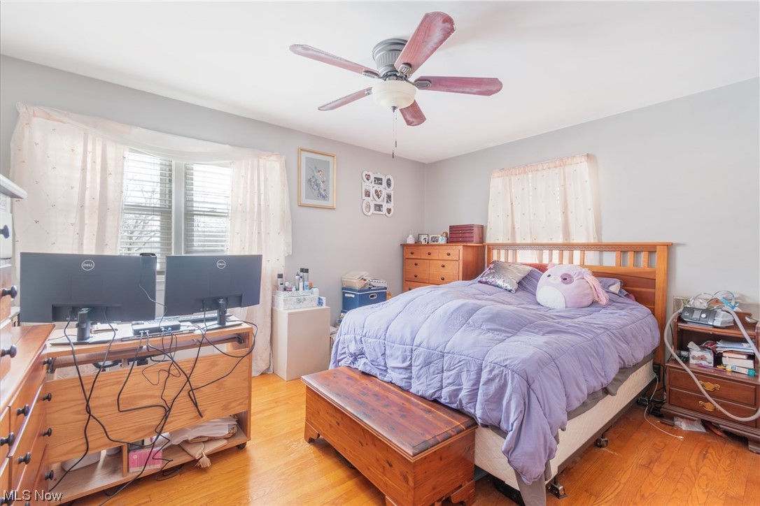 2926 Brunswick Road Youngstown, OH 44511 - Photo 21 of 33 Bedroom with light hardwood flooring, ceiling fan, and 3 windows