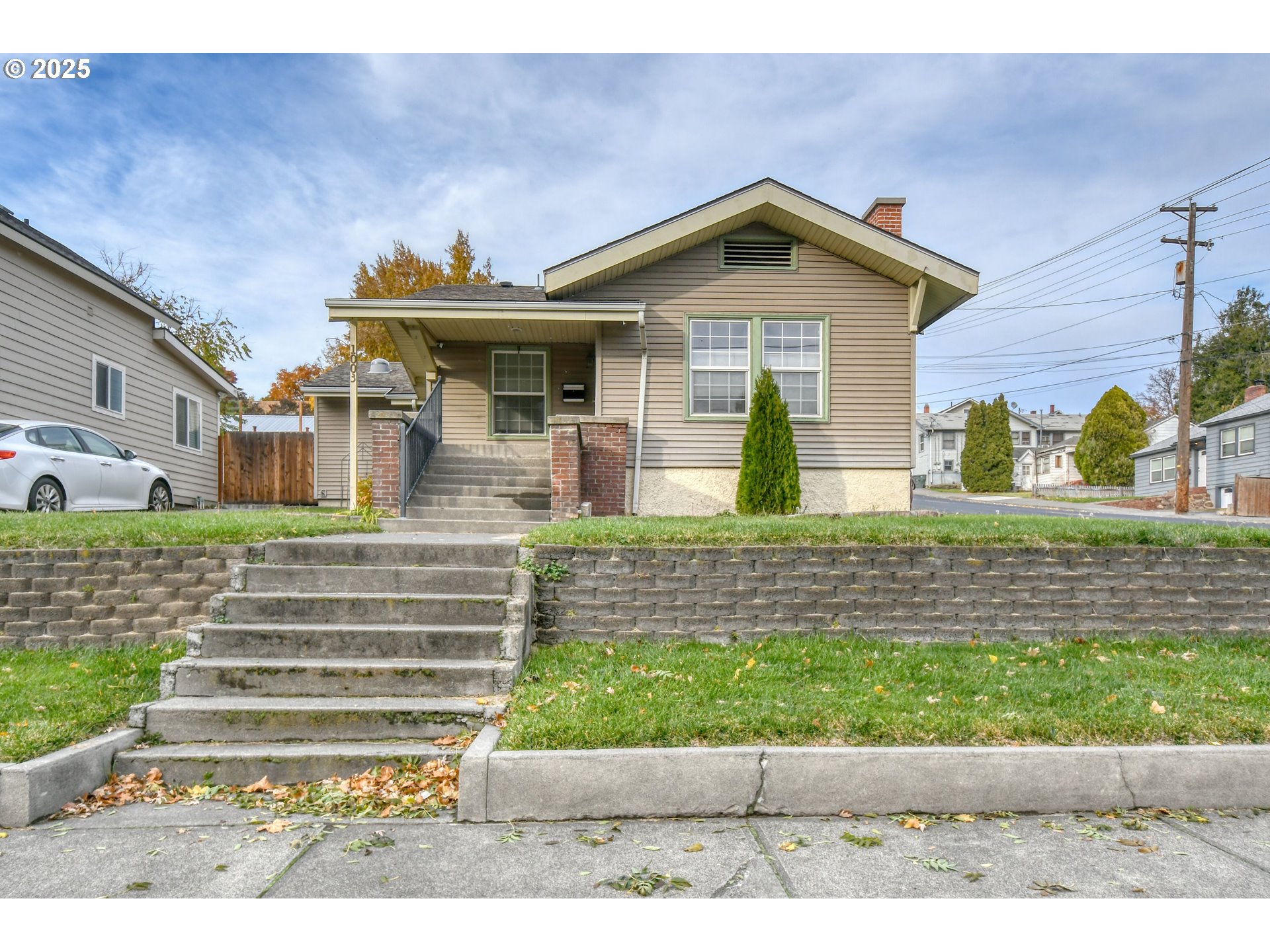 1003 Northwest Carden Avenue Pendleton, OR 97801 - Photo 1 of 48 a front view of a house with a yard