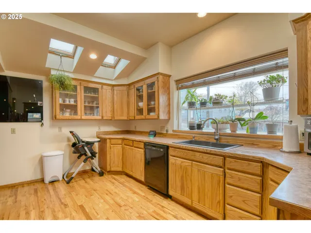a very nice looking kitchen with a large window