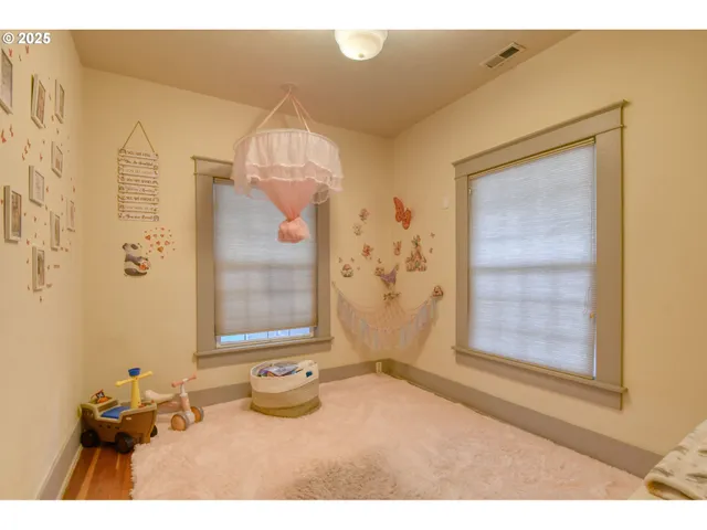 a bathroom with a toilet and shower