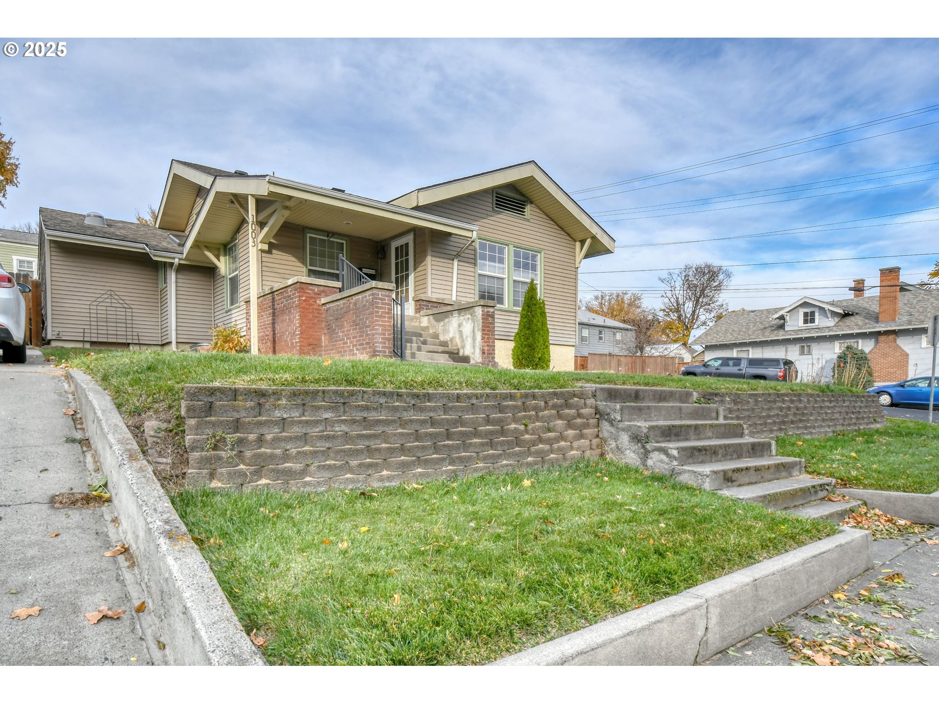 1003 Northwest Carden Avenue Pendleton, OR 97801 - Photo 3 of 48 a front view of a house with a yard
