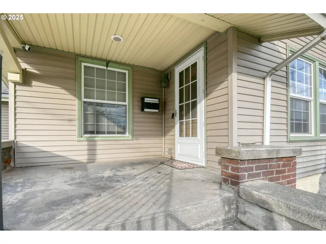 a view of backyard and wooden door