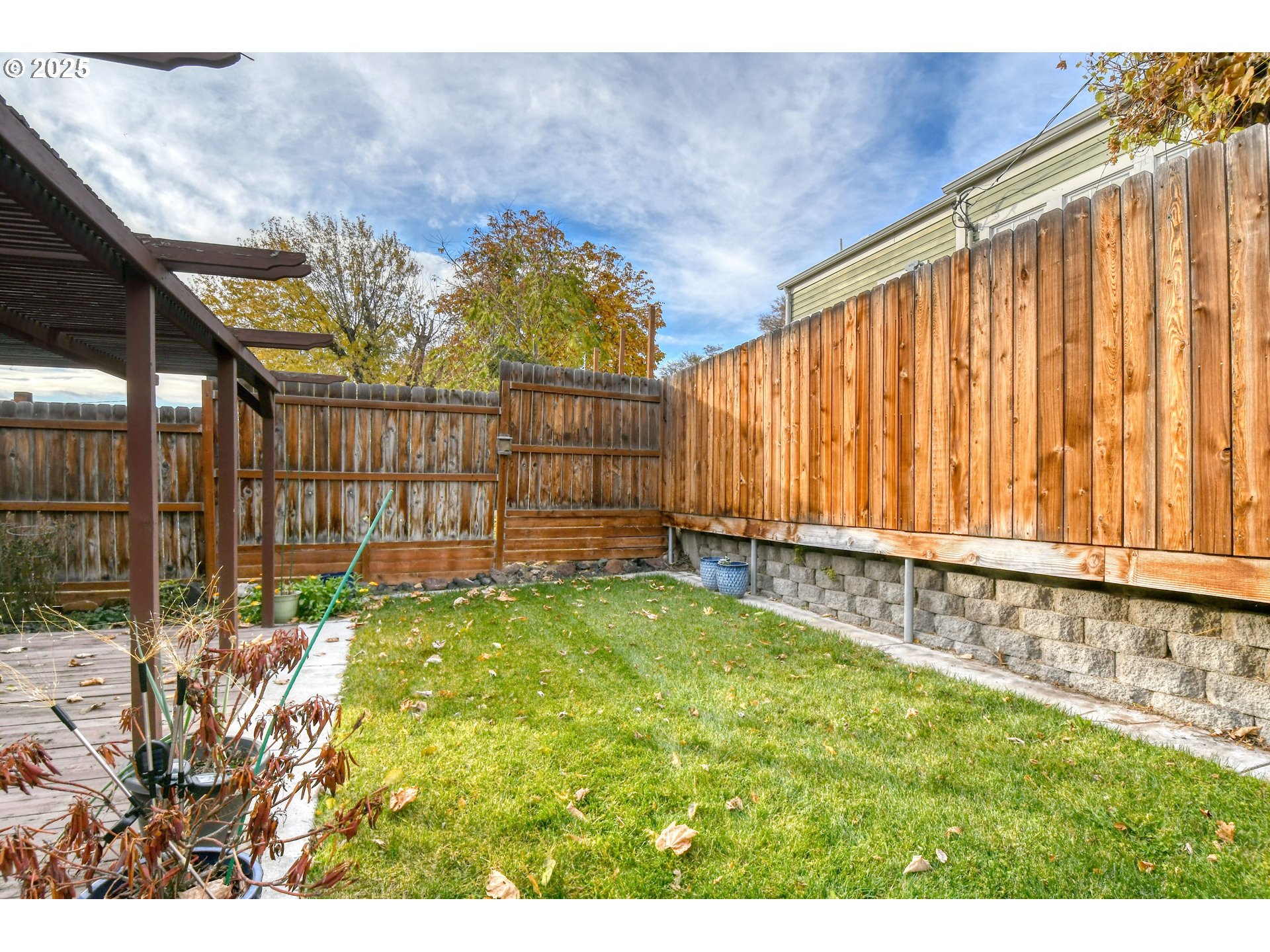 1003 Northwest Carden Avenue Pendleton, OR 97801 - Photo 44 of 48 a view of a backyard with wooden fence