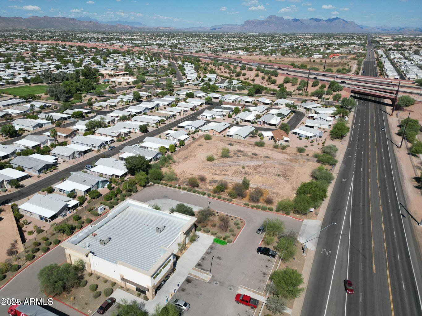 8442 East Southern Avenue, Unit 2 Mesa, AZ 85209 - Photo 4 of 4 an aerial view of residential houses with outdoor space