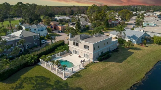 a front view of a house with a yard and a garage