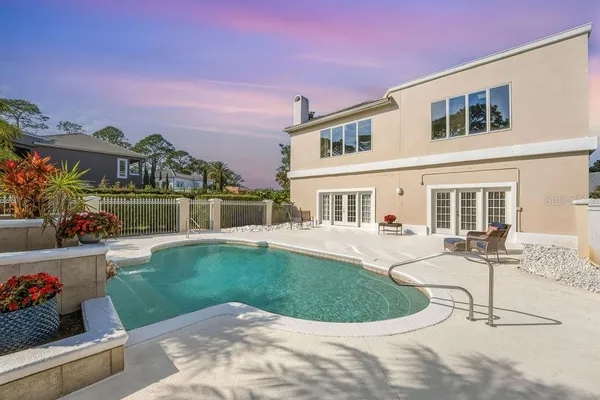 a view of a swimming pool with a patio