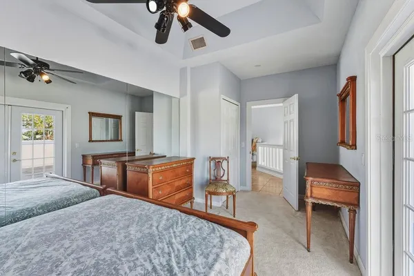 a front view of a house with a yard and tree s