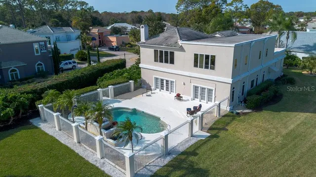 a kitchen with granite countertop white cabinets and black appliances