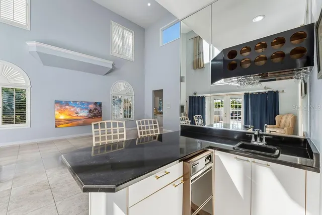 a view of a kitchen with cabinets stainless steel appliances and a counter top space