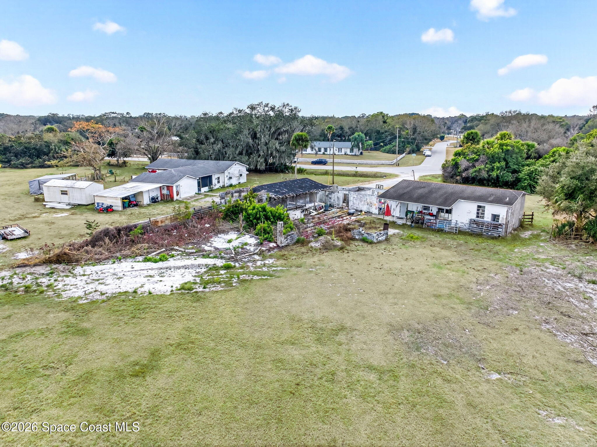 3825 Turtle Mound Road Melbourne, FL 32934 - Photo 19 of 19 a view of a lake with houses in the back