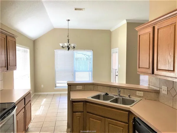 a bathroom with a sink and a window