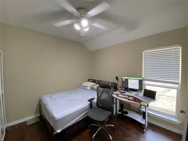 a bedroom with a workspace