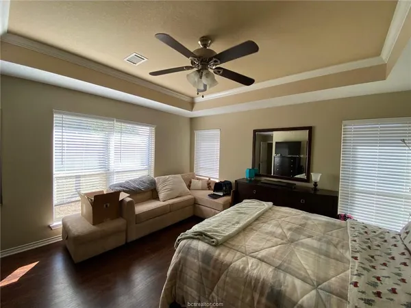 a spacious bedroom with two beds and a window