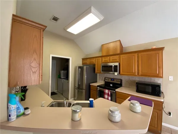 a dining room with a table and chairs
