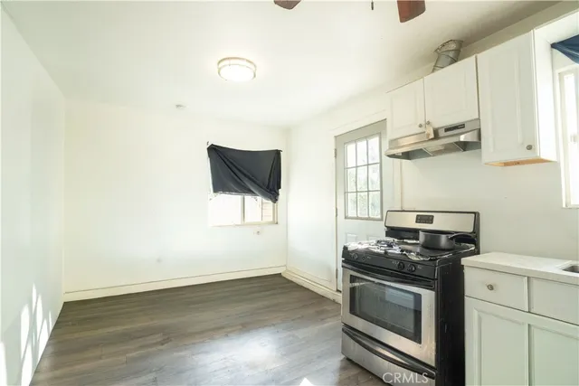 a bedroom with a bed and a mirror