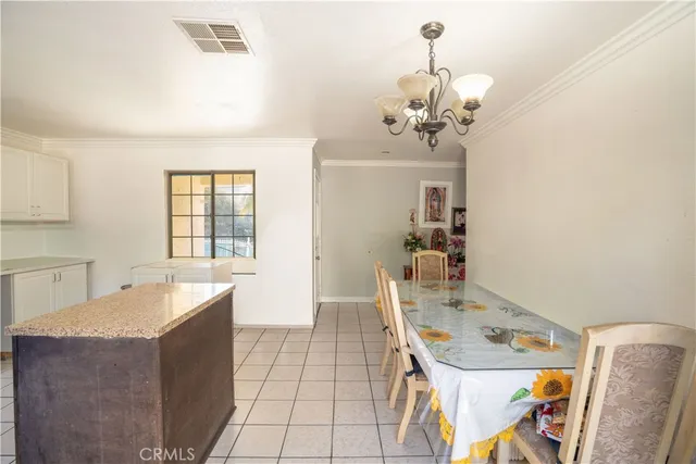 a view of a bedroom with furniture and windows