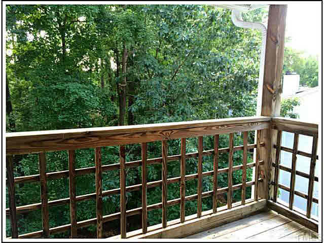 4601 Timbermill Court, Unit 301 Raleigh, NC 27612 - Photo 7 of 8 View from the back balcony. The beautiful trees shelter this home in nature, though it's actually close to shopping, restaurants, and main roads.