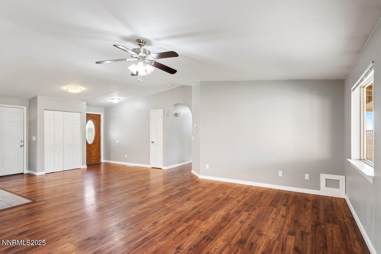 3560 Haystack Drive Carson City, NV 89705 - Photo 11 of 23 a view of an empty room with window and wooden floor