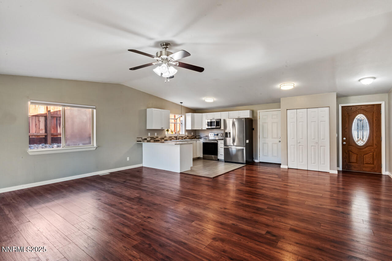3560 Haystack Drive Carson City, NV 89705 - Photo 12 of 23 a view of an empty room with wooden floor and a window