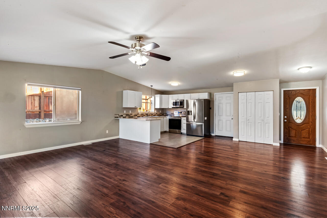 3560 Haystack Drive Carson City, NV 89705 - Photo 13 of 23 a view of an empty room with wooden floor and a window
