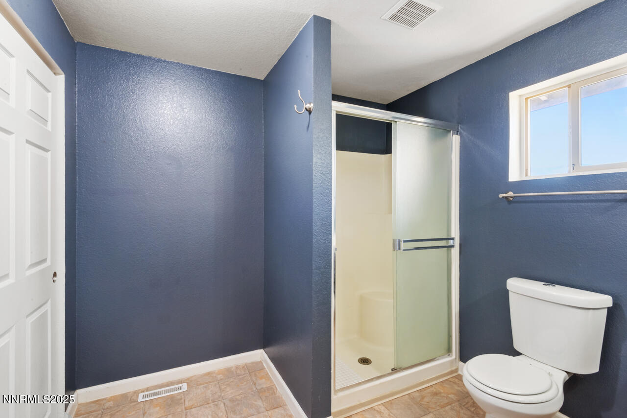 3560 Haystack Drive Carson City, NV 89705 - Photo 21 of 23 a white toilet sitting next to a bathroom sink