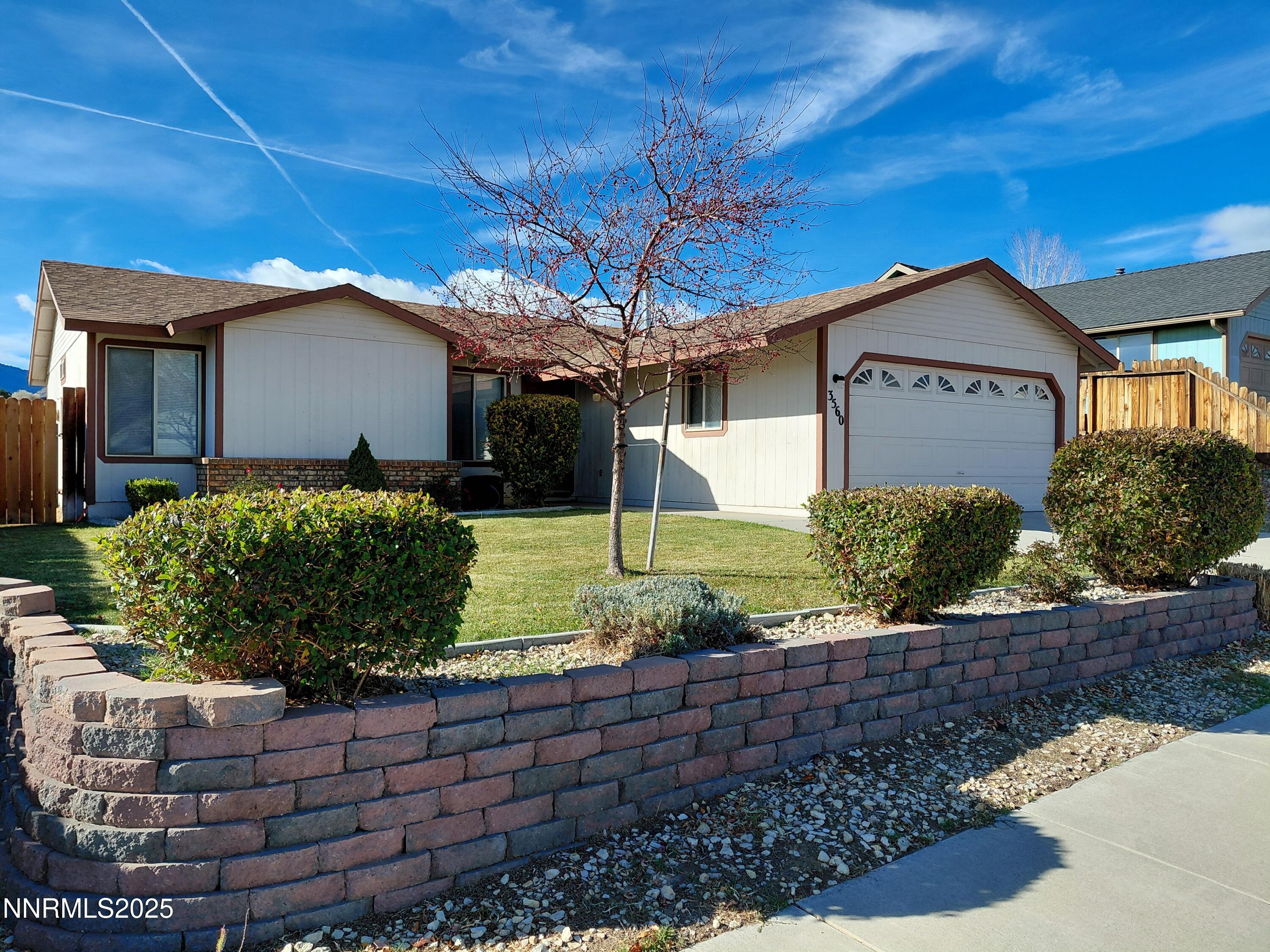 3560 Haystack Drive Carson City, NV 89705 - Photo 3 of 23 a front view of a house with a yard