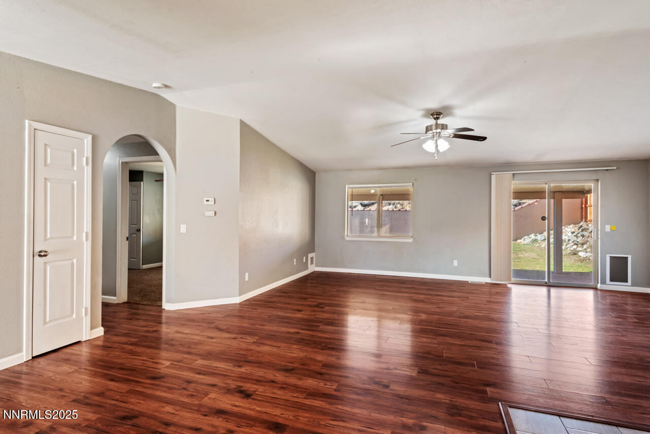 3560 Haystack Drive Carson City, NV 89705 - Photo 10 of 23 a view of an empty room with wooden floor and a window