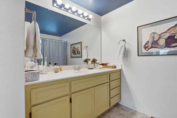 a bedroom with a bed and a table