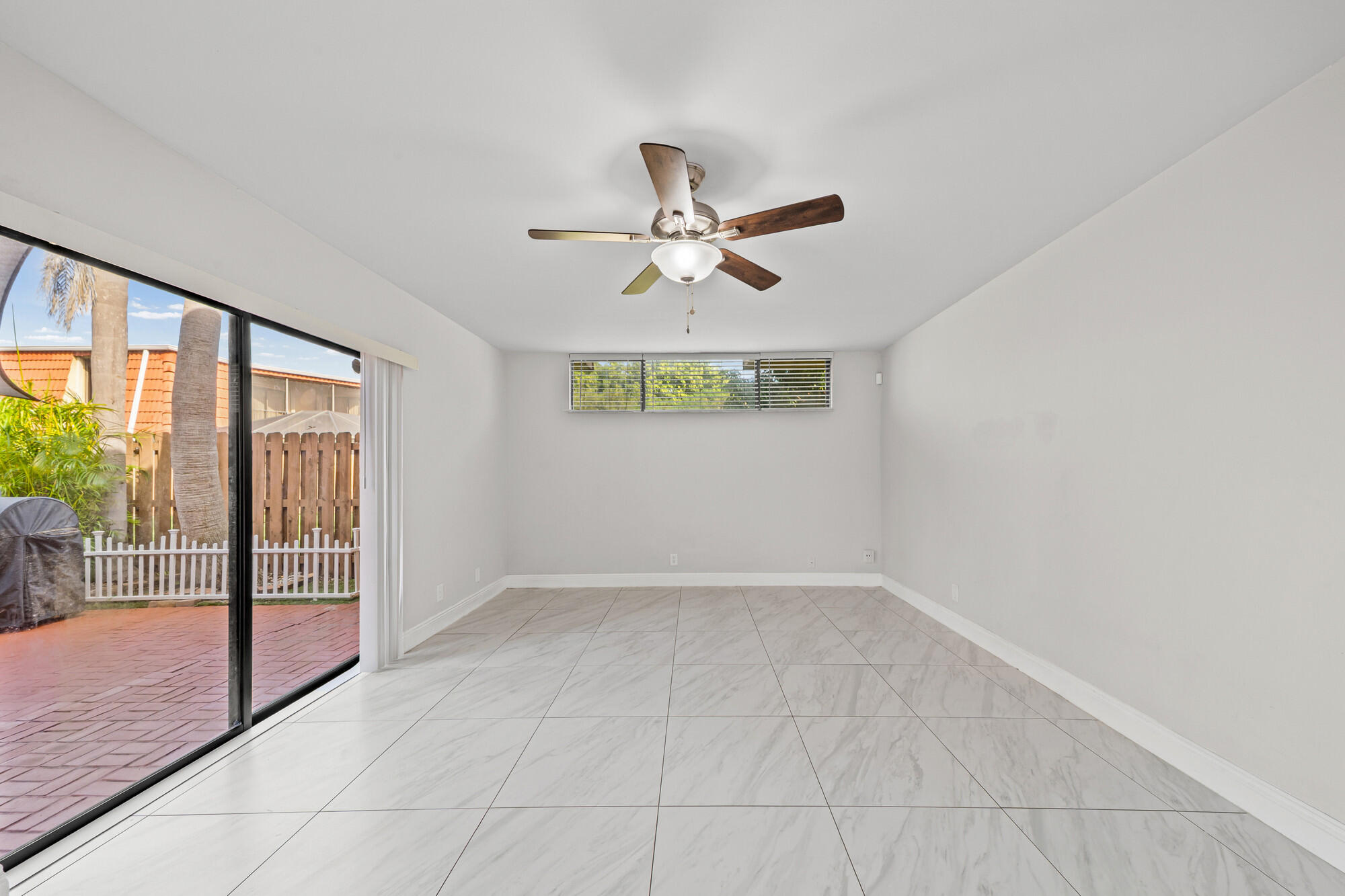 8194 Thames Boulevard, Unit B Boca Raton, FL 33433 - Photo 11 of 49 a view of an empty room with a window