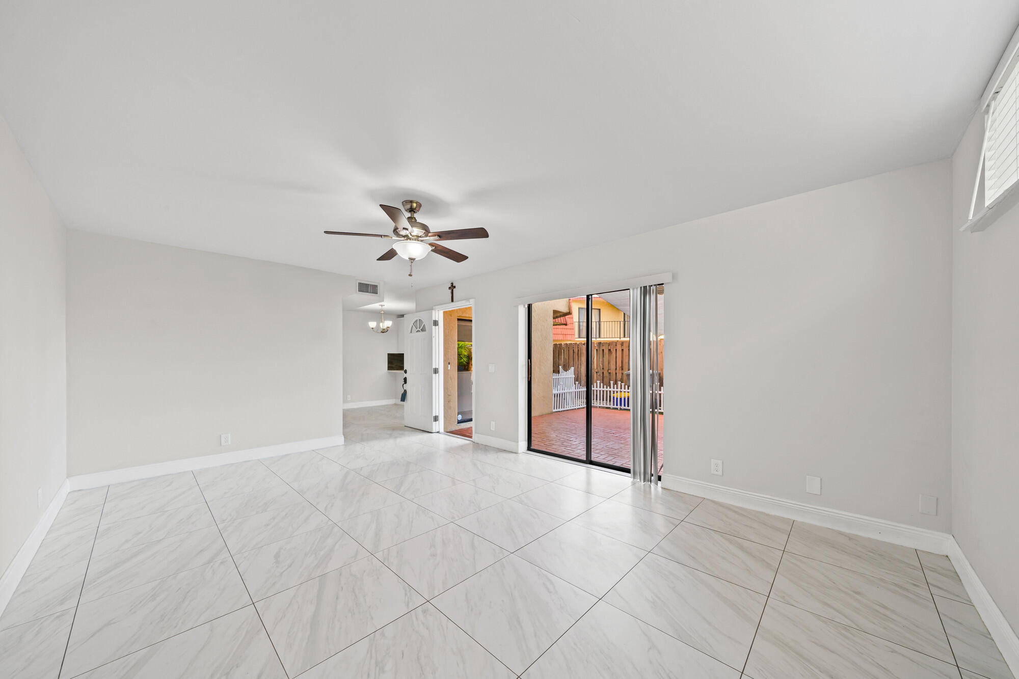 8194 Thames Boulevard, Unit B Boca Raton, FL 33433 - Photo 13 of 49 wooden floor in an empty room with a window