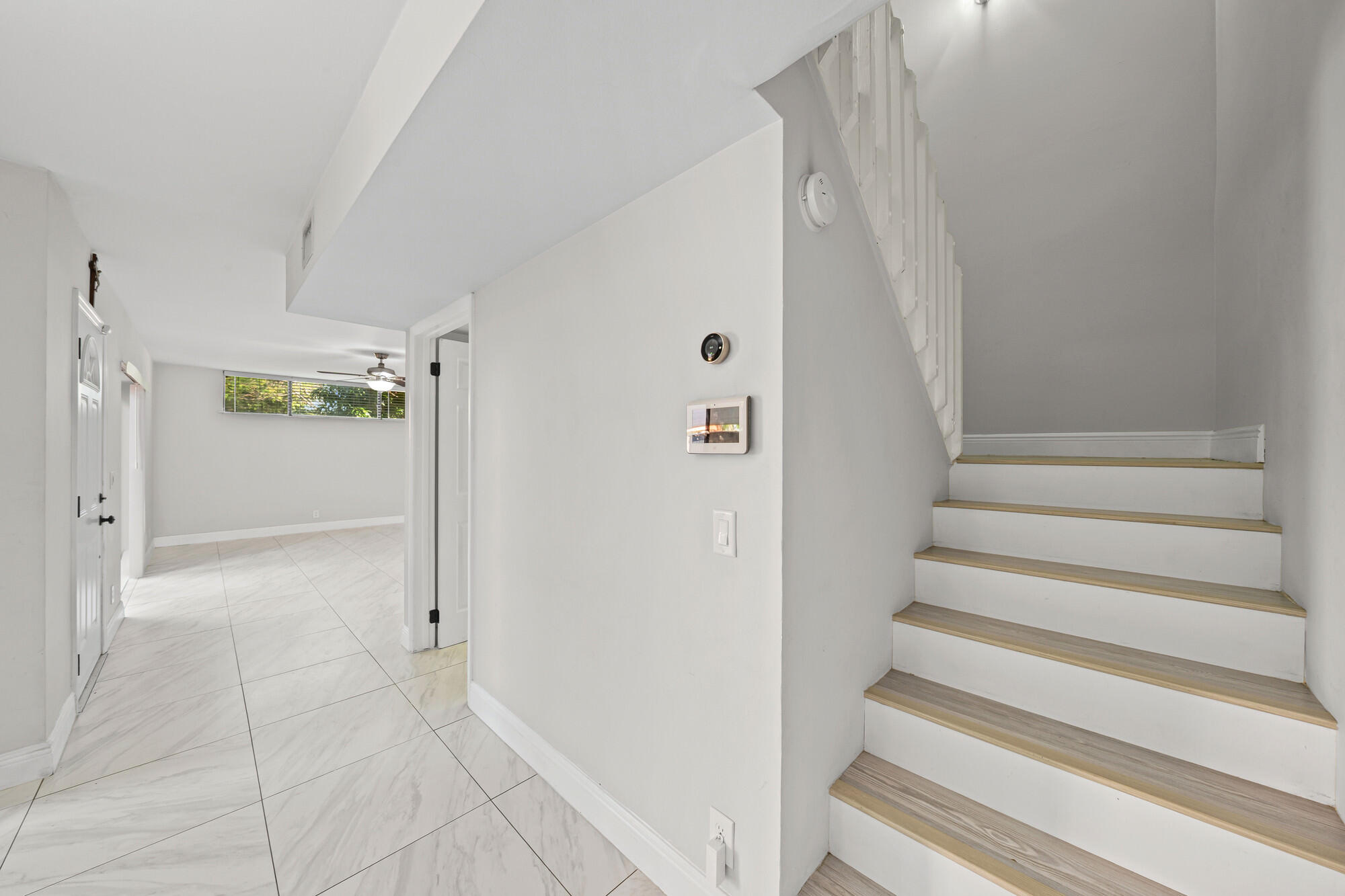 8194 Thames Boulevard, Unit B Boca Raton, FL 33433 - Photo 17 of 49 a view of an entryway with staircase