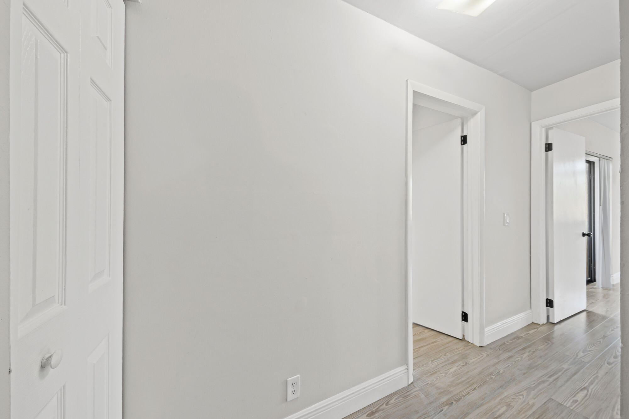 8194 Thames Boulevard, Unit B Boca Raton, FL 33433 - Photo 19 of 49 a view of a hallway with wooden floor