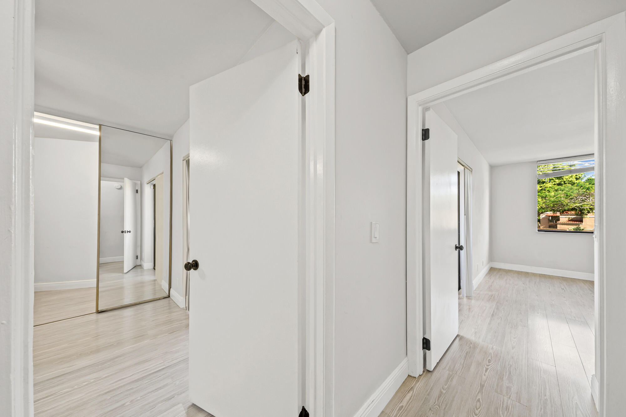 8194 Thames Boulevard, Unit B Boca Raton, FL 33433 - Photo 20 of 49 a view of a hallway with wooden floor