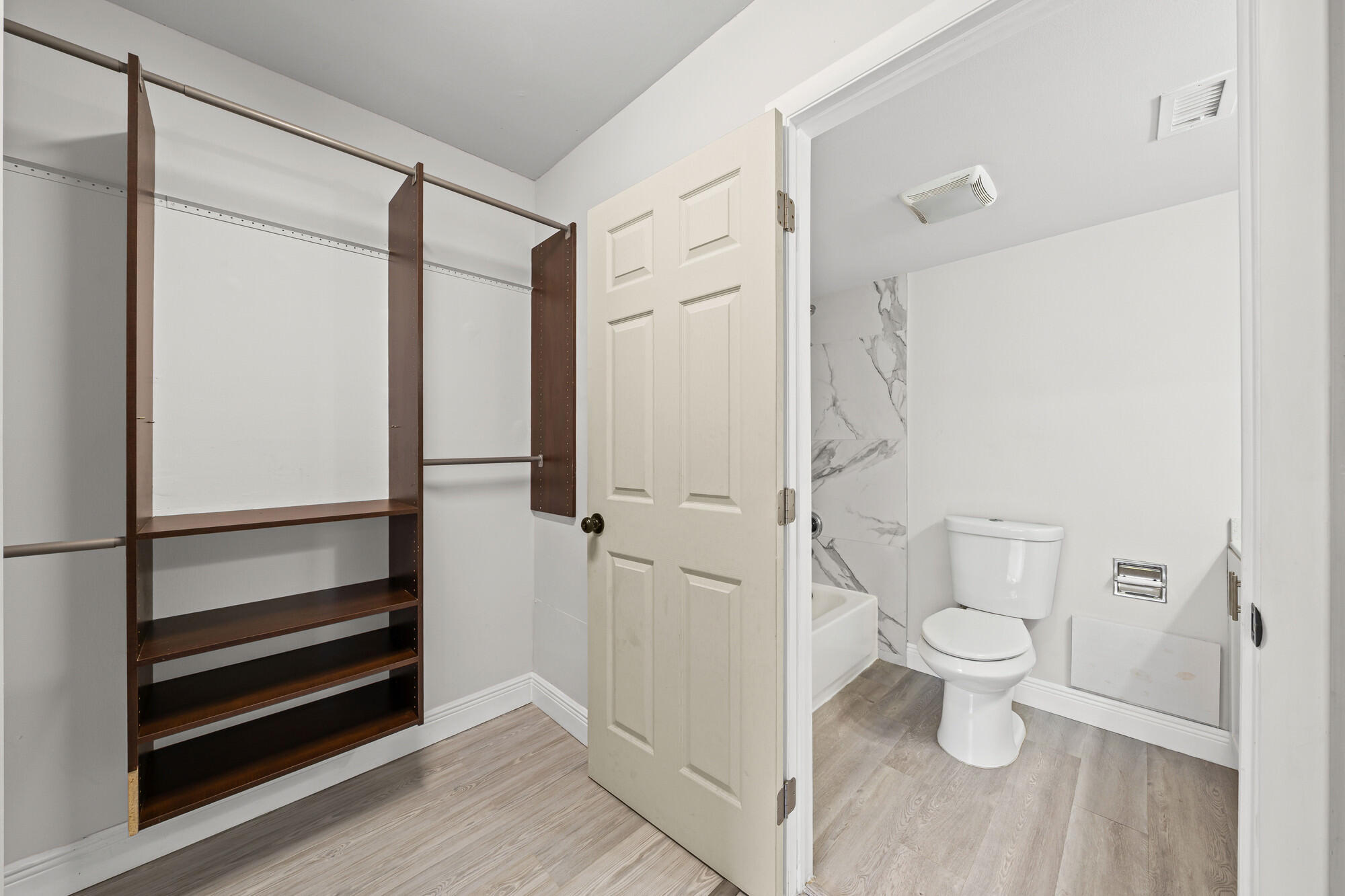 8194 Thames Boulevard, Unit B Boca Raton, FL 33433 - Photo 23 of 49 a bathroom with a toilet and a shower