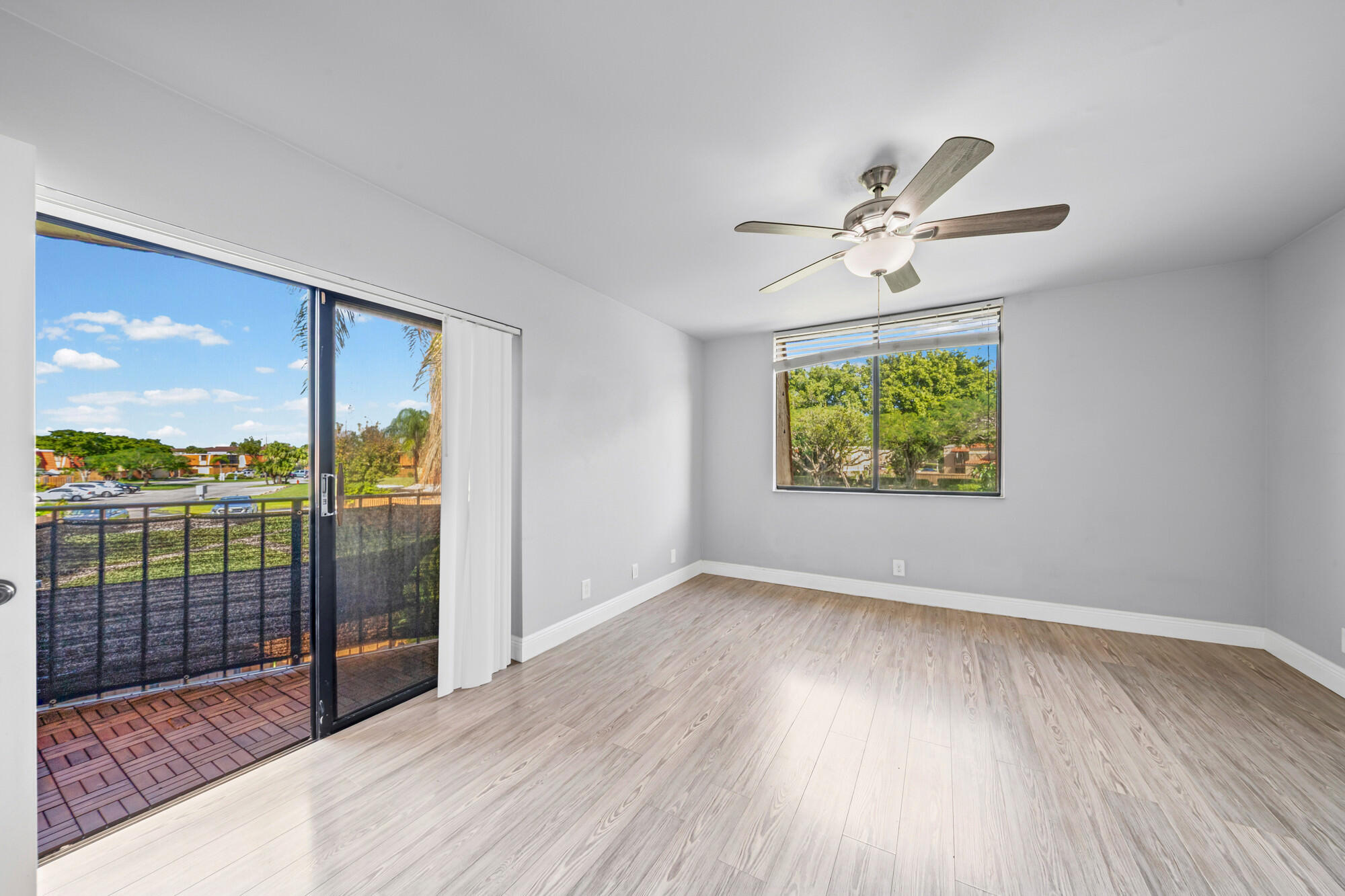 8194 Thames Boulevard, Unit B Boca Raton, FL 33433 - Photo 28 of 49 wooden floor in an empty room with a window