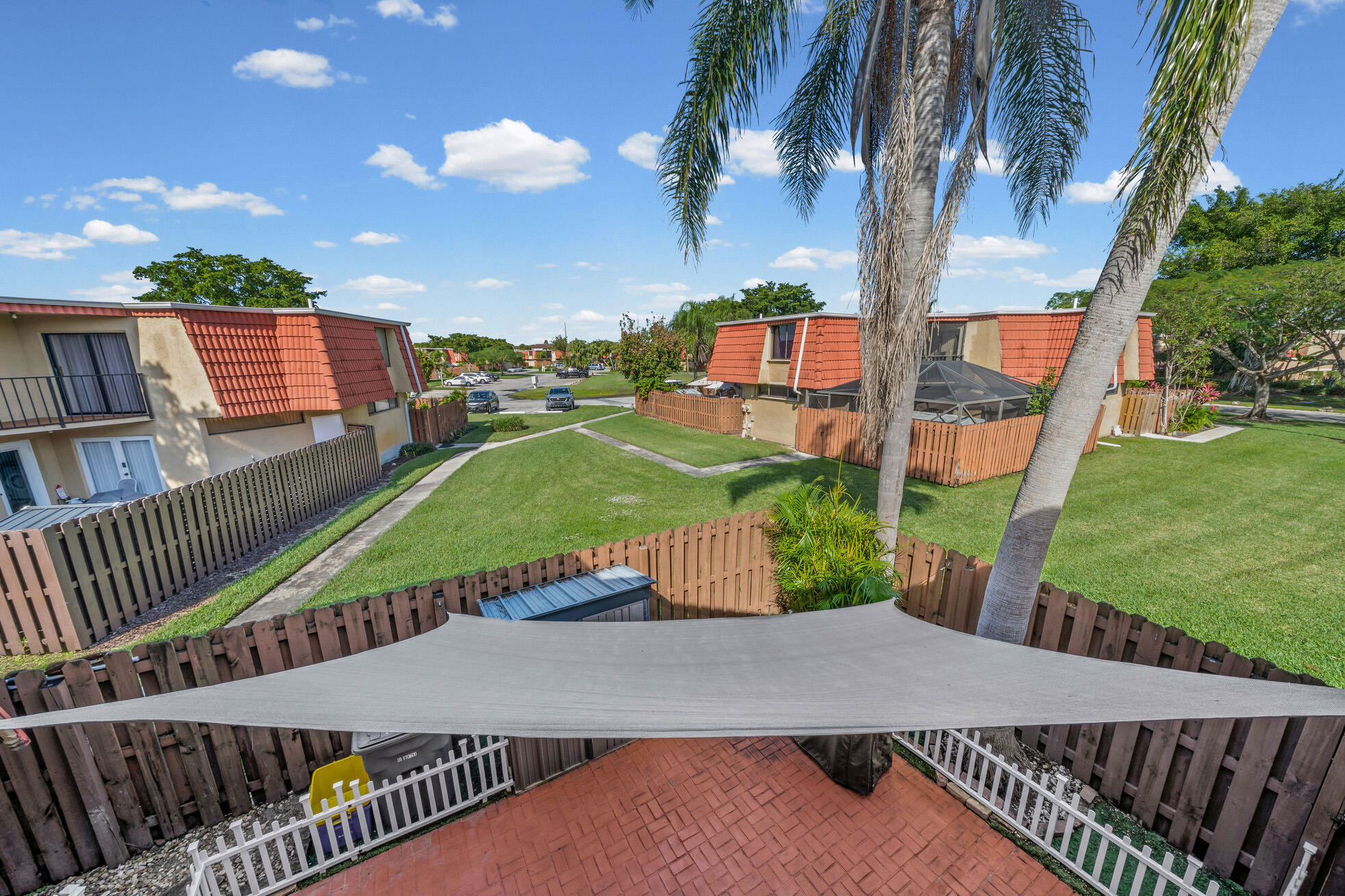 8194 Thames Boulevard, Unit B Boca Raton, FL 33433 - Photo 30 of 49 a view of a patio with a yard