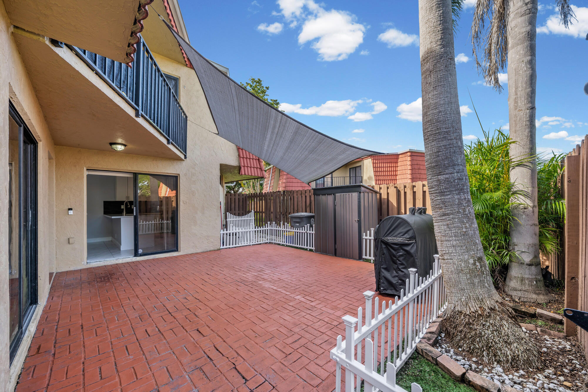 8194 Thames Boulevard, Unit B Boca Raton, FL 33433 - Photo 3 of 49 a view of a house with backyard and sitting area