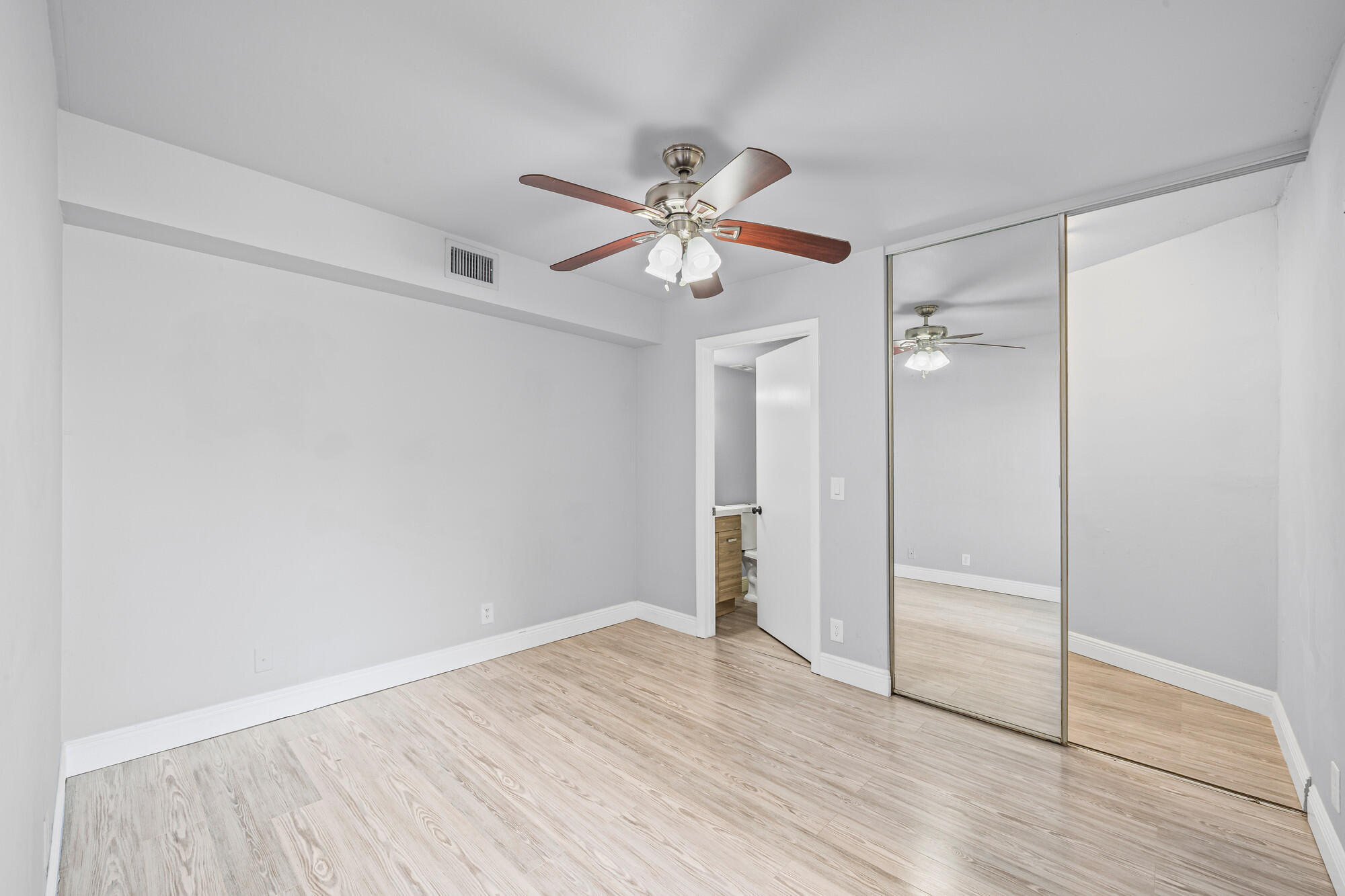 8194 Thames Boulevard, Unit B Boca Raton, FL 33433 - Photo 33 of 49 wooden floor in an empty room