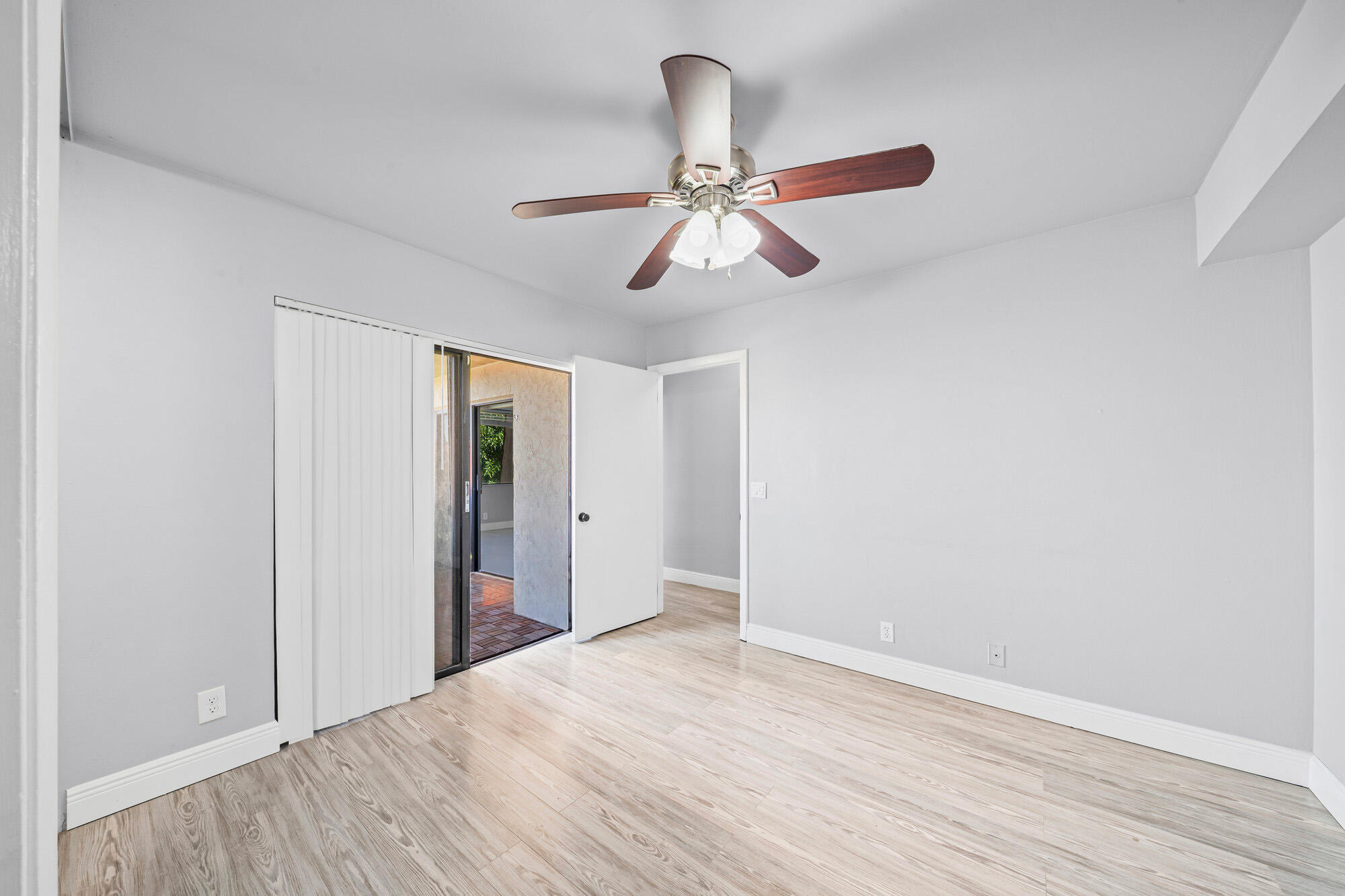 8194 Thames Boulevard, Unit B Boca Raton, FL 33433 - Photo 38 of 49 a view of empty room with wooden floor
