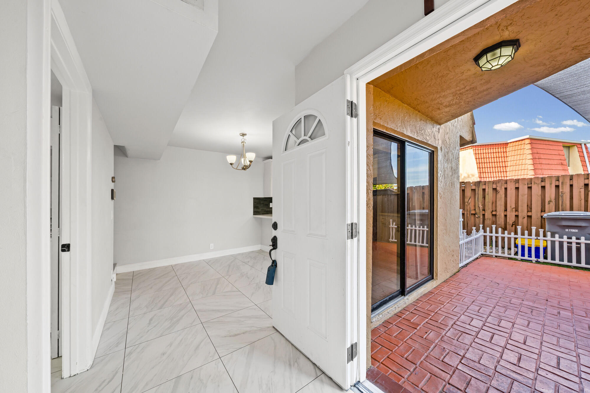 8194 Thames Boulevard, Unit B Boca Raton, FL 33433 - Photo 5 of 49 a view of a hallway with a door and wooden floor