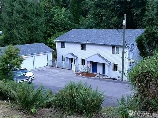 a house view with a garden space