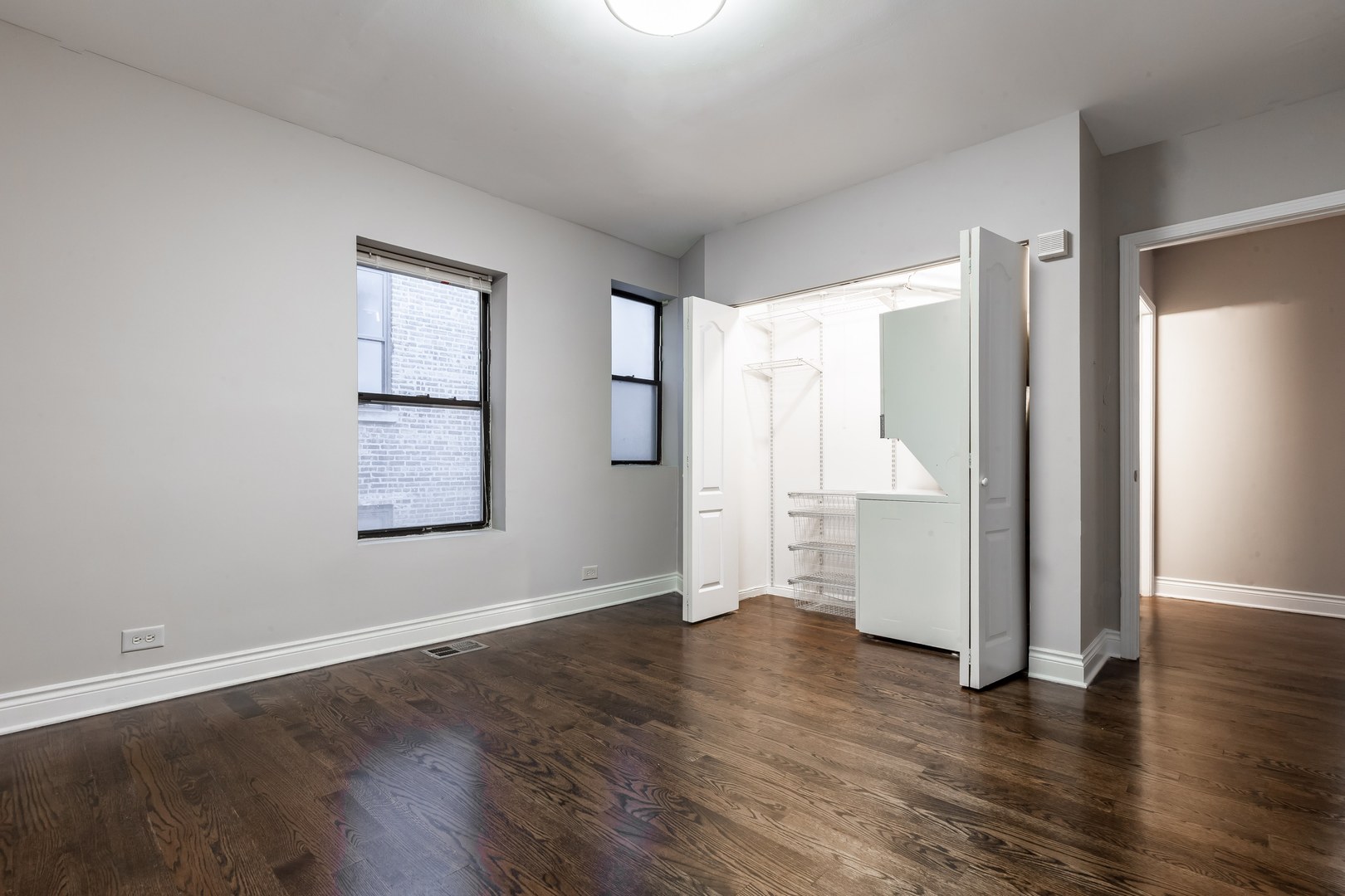 4529.5 South Drexel Boulevard, Unit 2W Chicago, IL 60653 - Photo 11 of 11 an empty room with wooden floor and windows