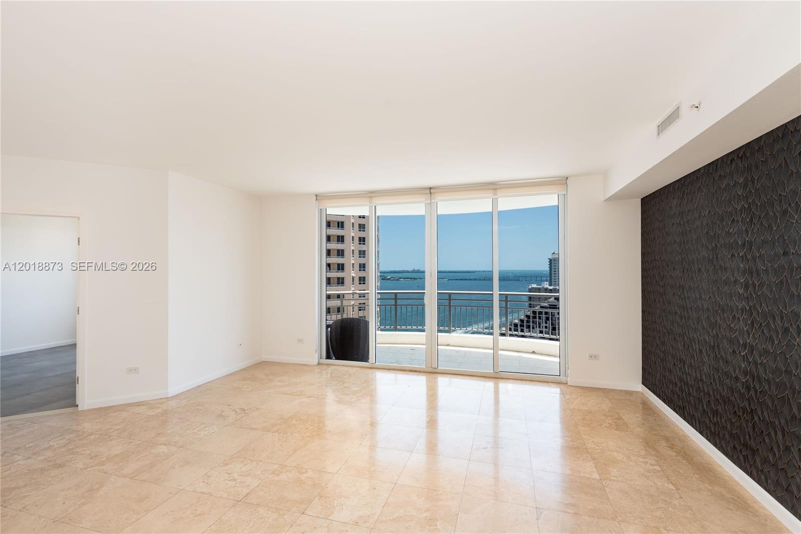 848 Brickell Key Drive, Unit 2703 Miami, FL 33131 - Photo 15 of 30 a view of an empty room with a window
