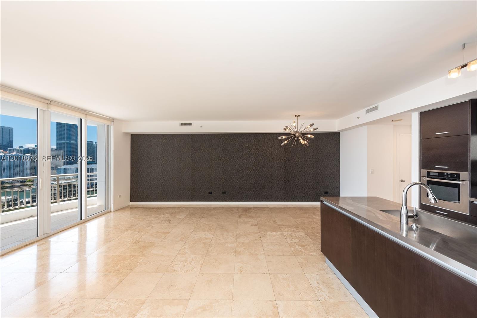 848 Brickell Key Drive, Unit 2703 Miami, FL 33131 - Photo 18 of 30 a view of kitchen with a sink and a large window